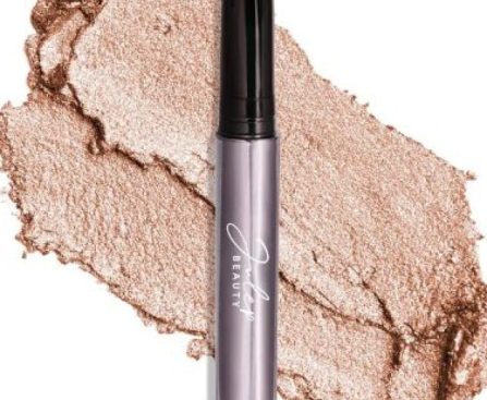 A Julep Eyeshadow 101 Crème-to-Powder Waterproof Eyeshadow Stick in Champagne Shimmer, featuring a medium golden-beige shimmer with a built-in smudger for easy blending.